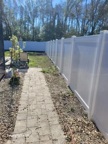 a view of a backyard with pathway