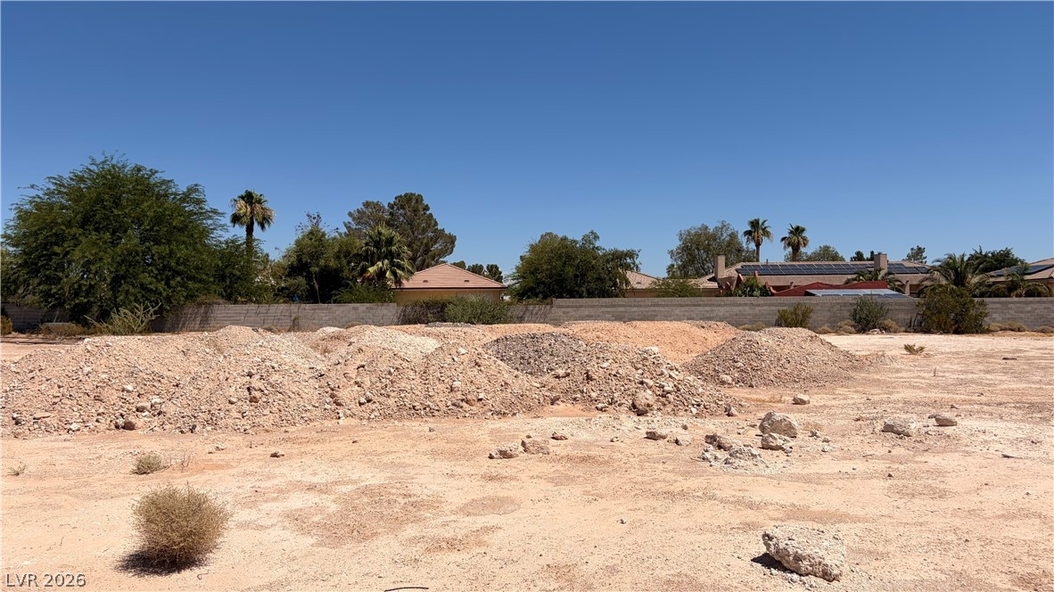 8811 Rancho Destino Road Las Vegas, NV 89123 - Photo 5 of 10 Ready for development, this spacious desert lot awaits your vision amidst established neighborhood residences.