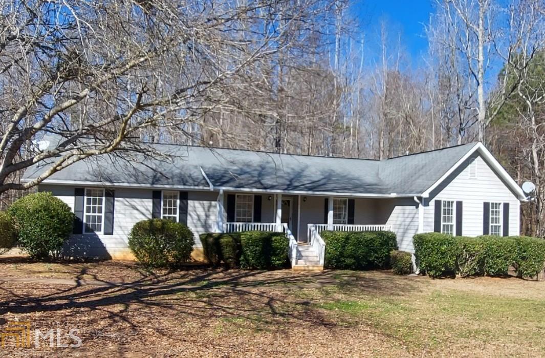 1009 Hamilton Drive Locust Grove, GA 30248 - Photo 1 of 1 a front view of a house with garden