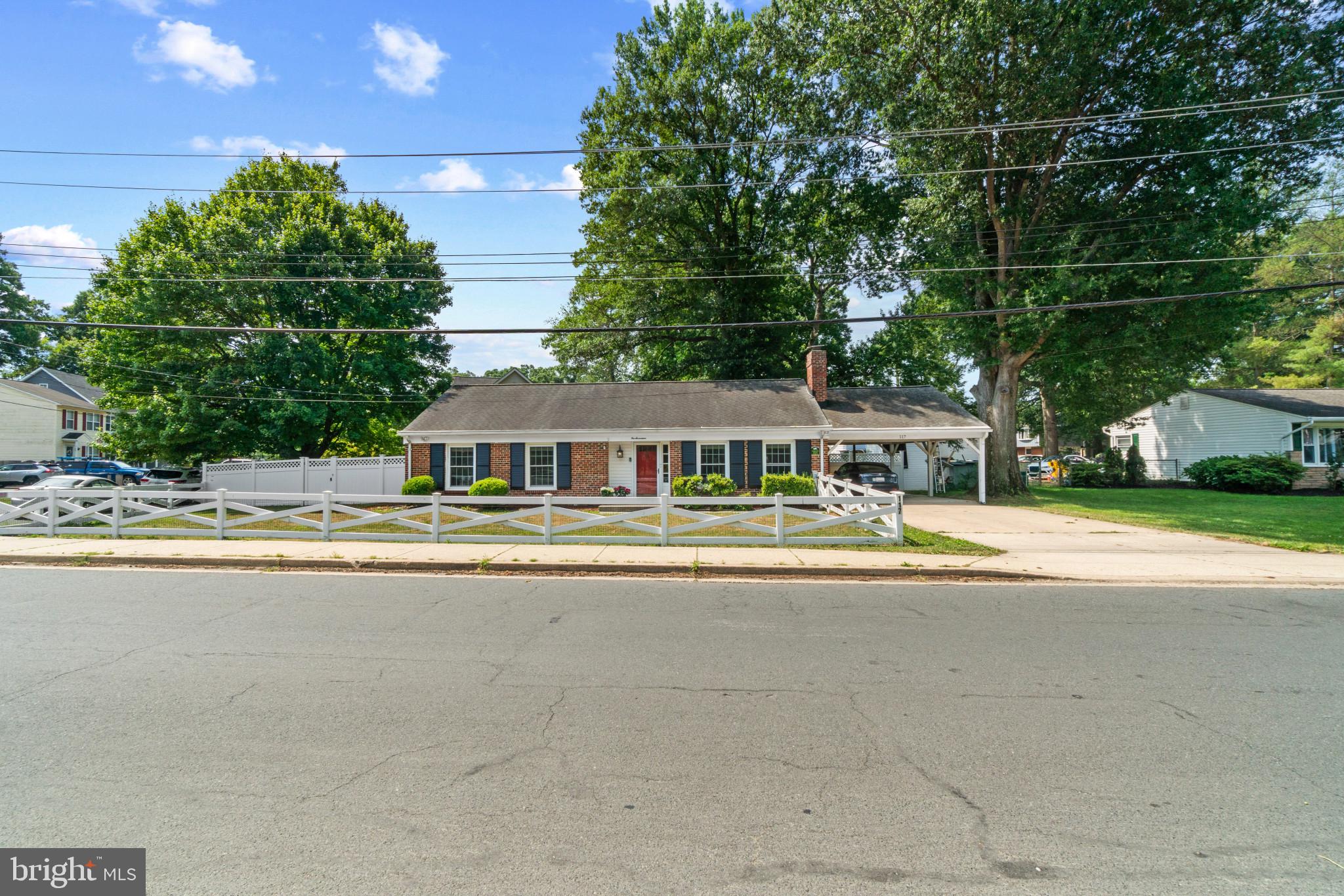117 Oakwood Road Edgewater, MD 21037 - Photo 52 of 52 Brick exterior featuring a white picket fence, cov