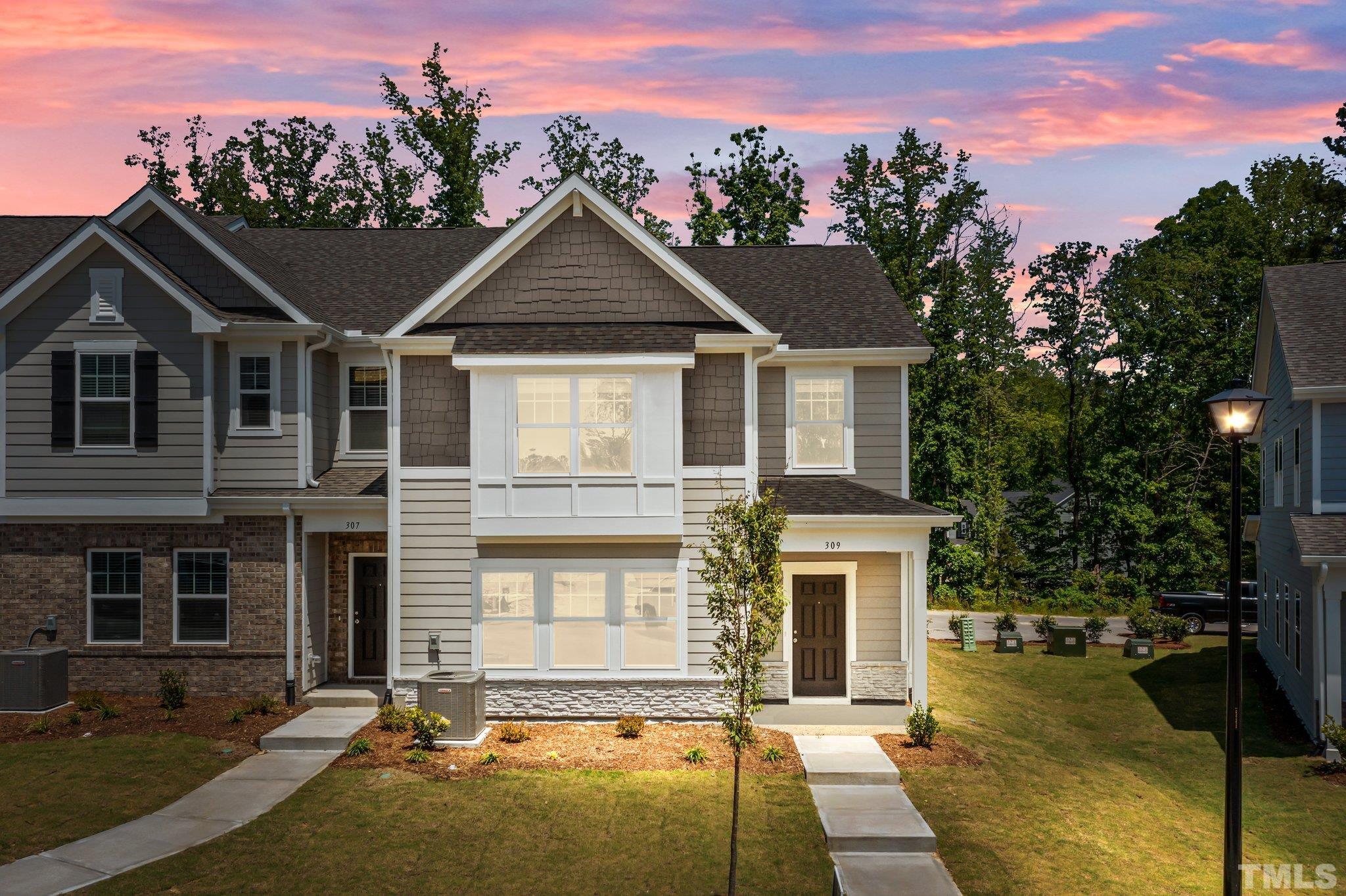 309 Spaight Acrs Way Wake Forest, NC 27587 - Photo 1 of 41 a front view of a house with a yard