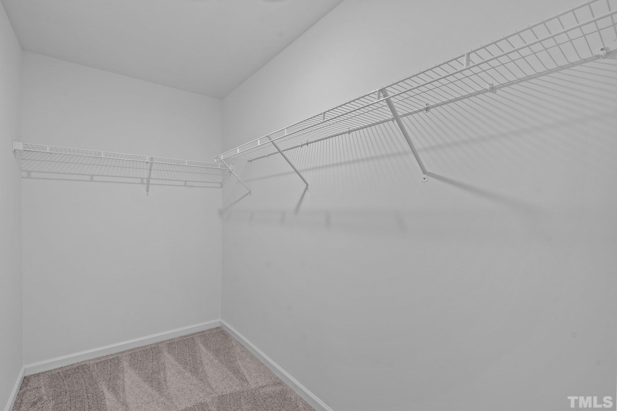 309 Spaight Acrs Way Wake Forest, NC 27587 - Photo 19 of 41 a view of a room with racks on the wall