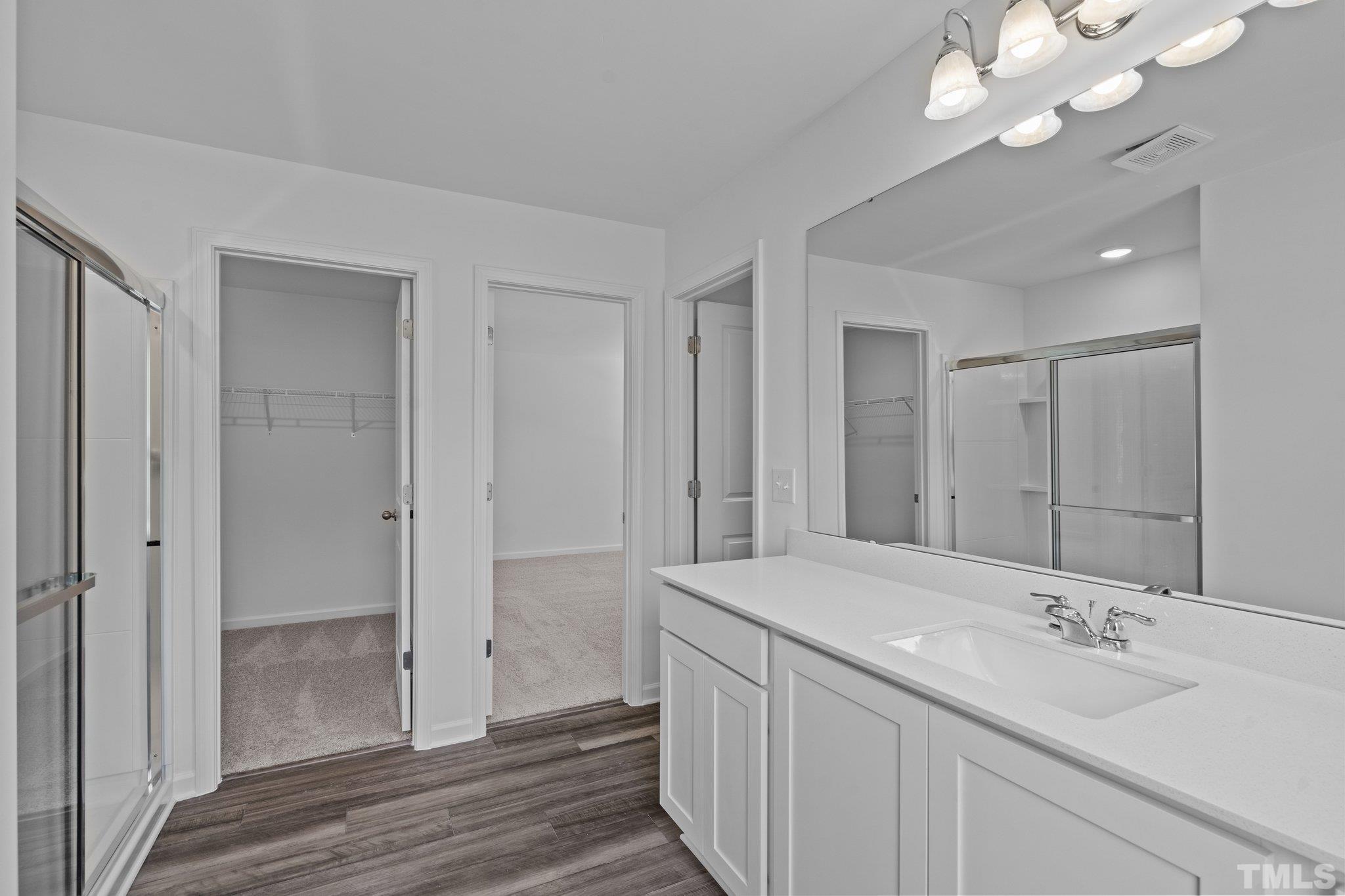 309 Spaight Acrs Way Wake Forest, NC 27587 - Photo 20 of 41 a bathroom with a sink vanity and a mirror