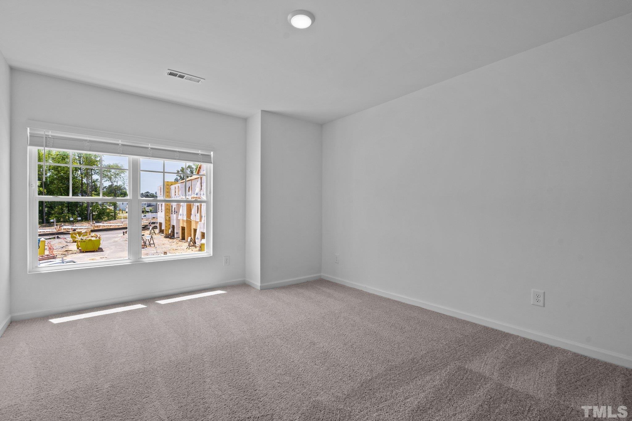 309 Spaight Acrs Way Wake Forest, NC 27587 - Photo 23 of 41 a view of an empty room with a window