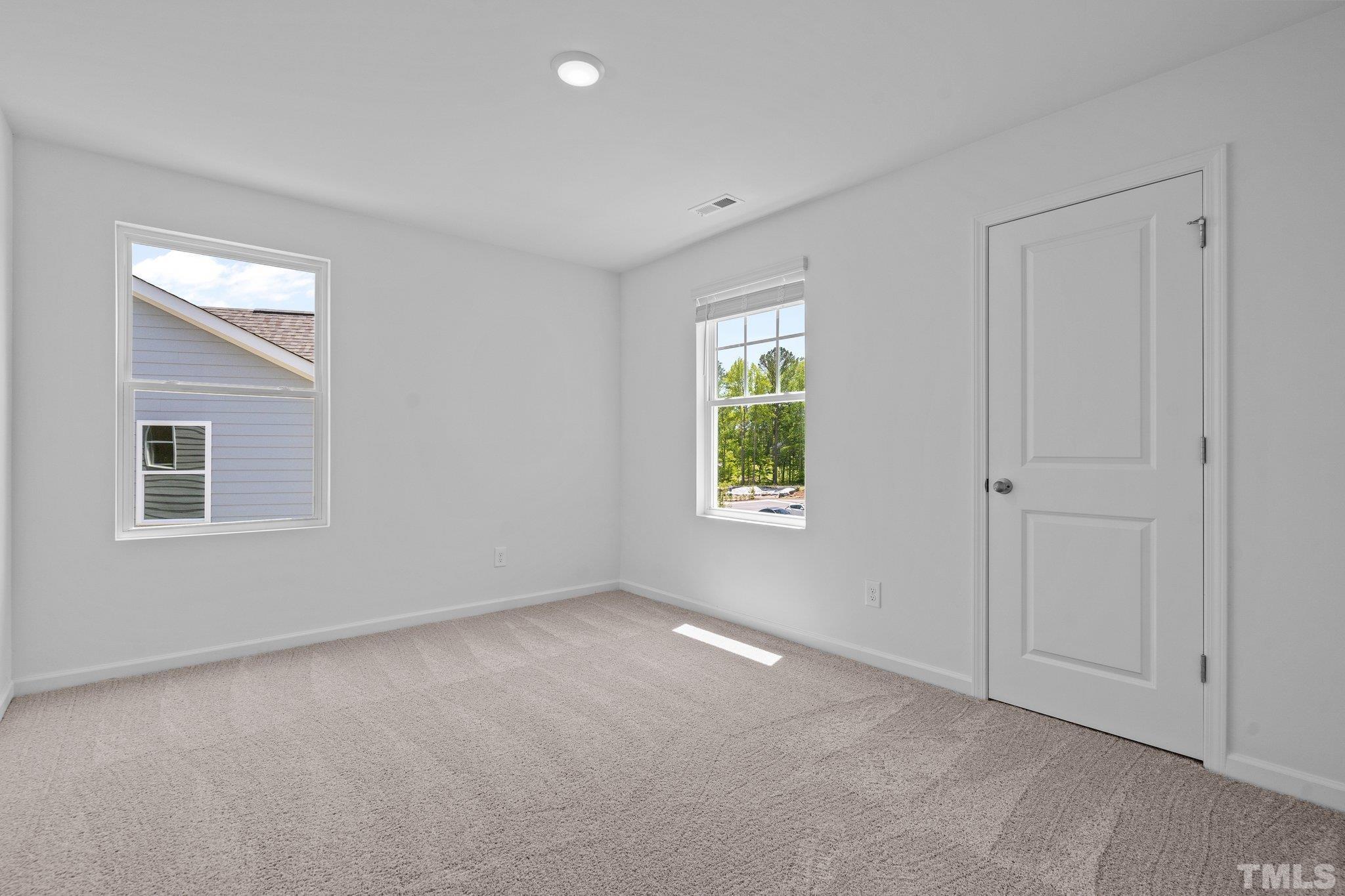 309 Spaight Acrs Way Wake Forest, NC 27587 - Photo 25 of 41 an empty room with windows