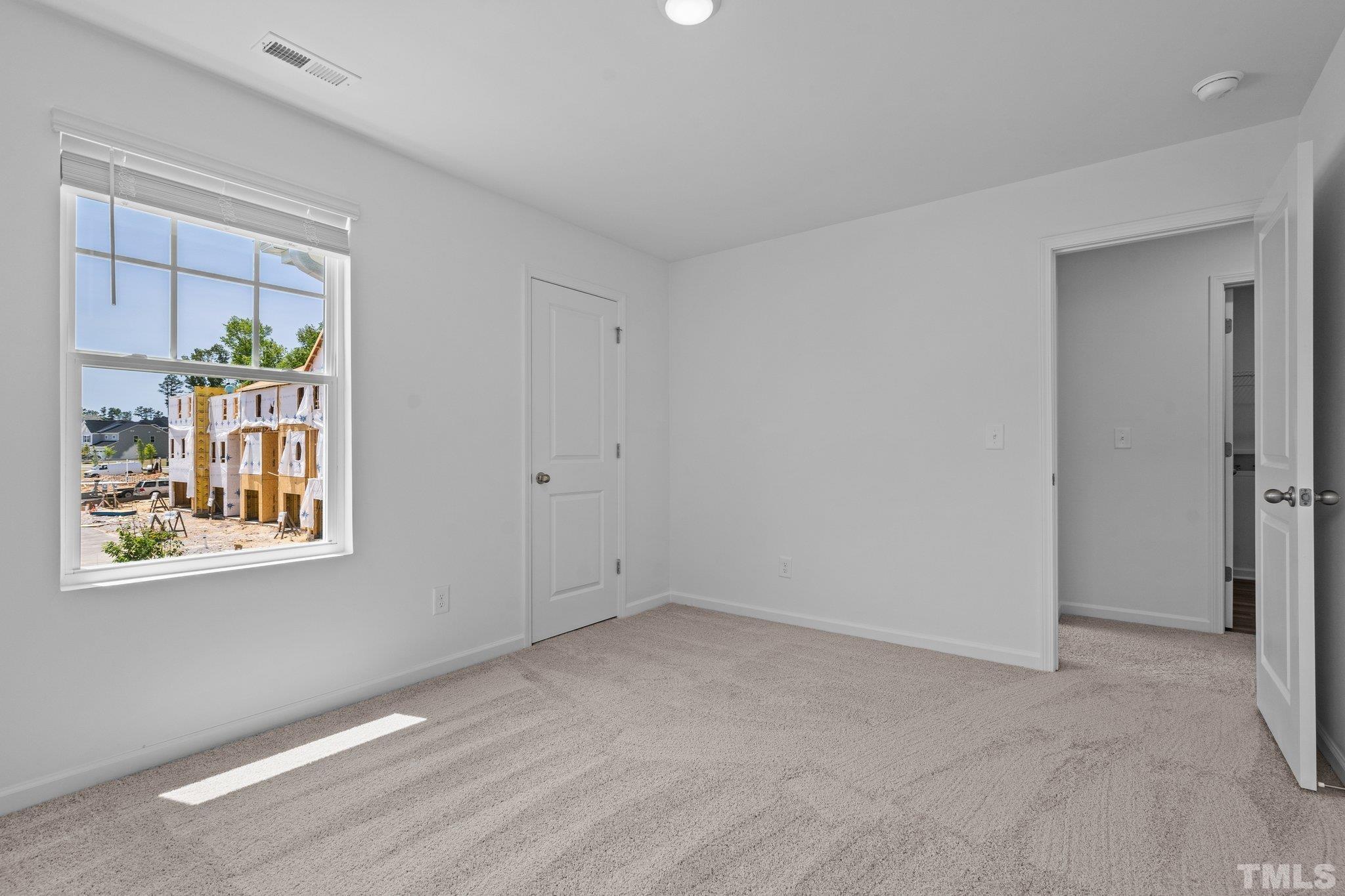 309 Spaight Acrs Way Wake Forest, NC 27587 - Photo 26 of 41 a view of an empty room with a window