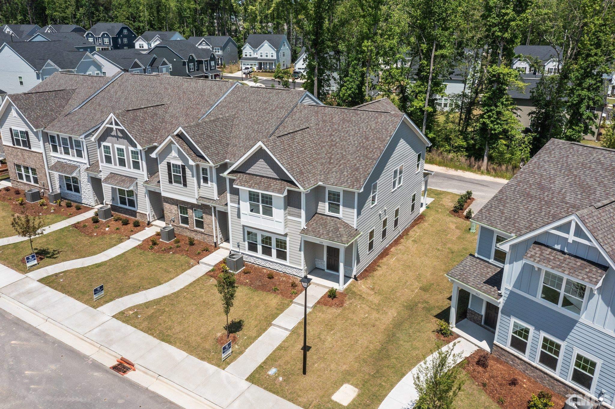 309 Spaight Acrs Way Wake Forest, NC 27587 - Photo 27 of 41 a view of a white building among the street