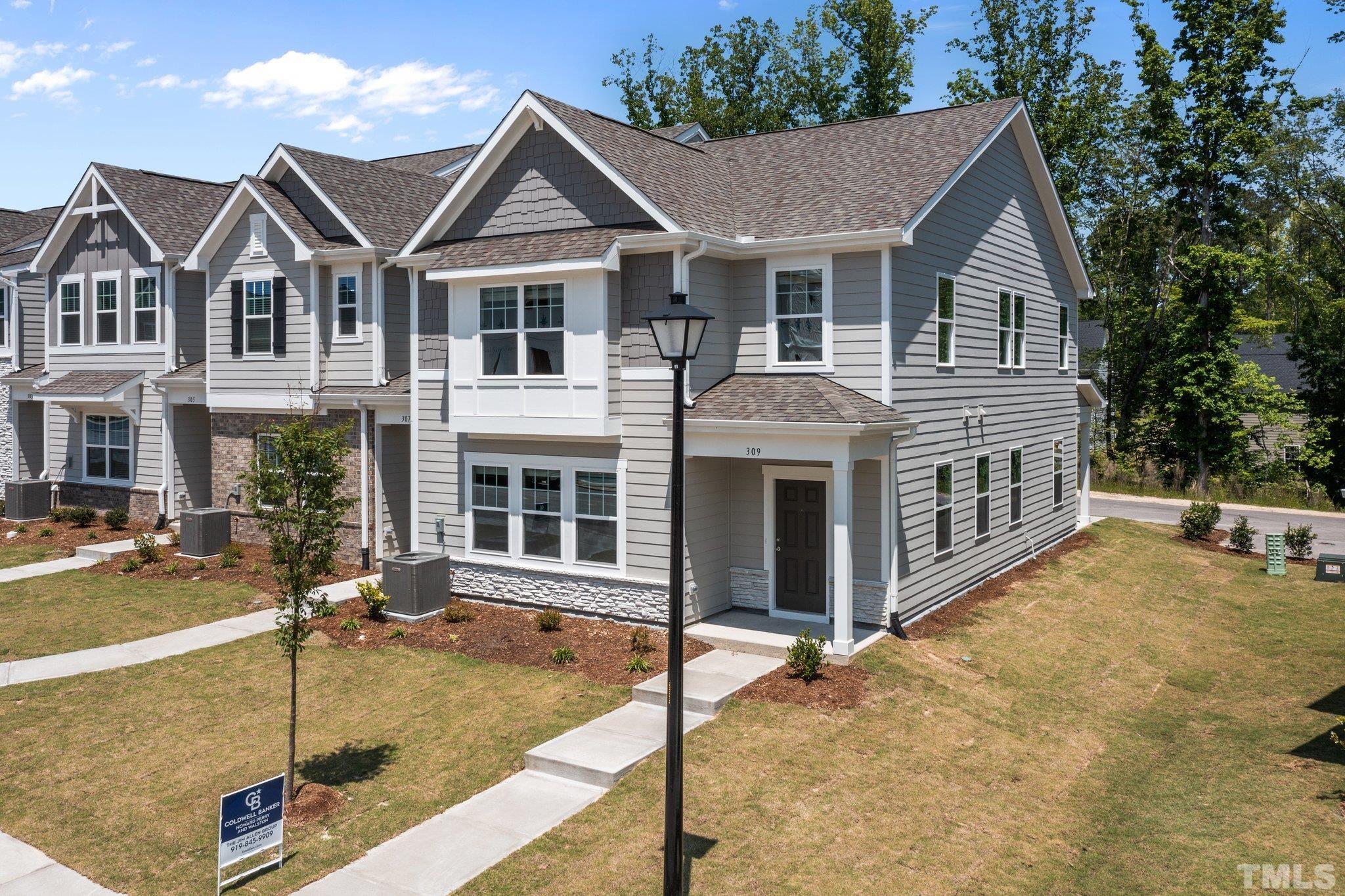 309 Spaight Acrs Way Wake Forest, NC 27587 - Photo 30 of 41 a front view of a house with garage