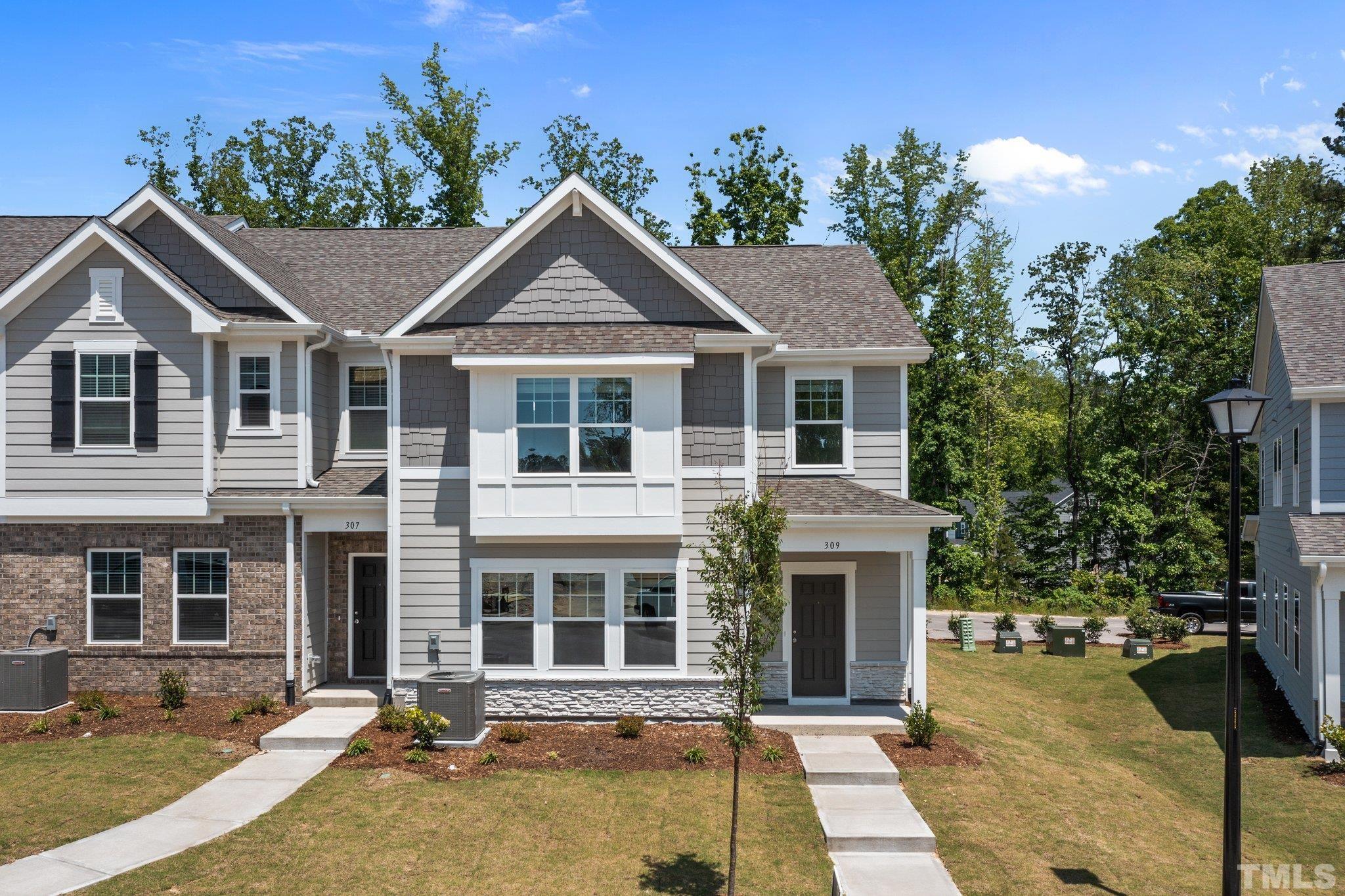 309 Spaight Acrs Way Wake Forest, NC 27587 - Photo 32 of 41 a front view of a house with a yard
