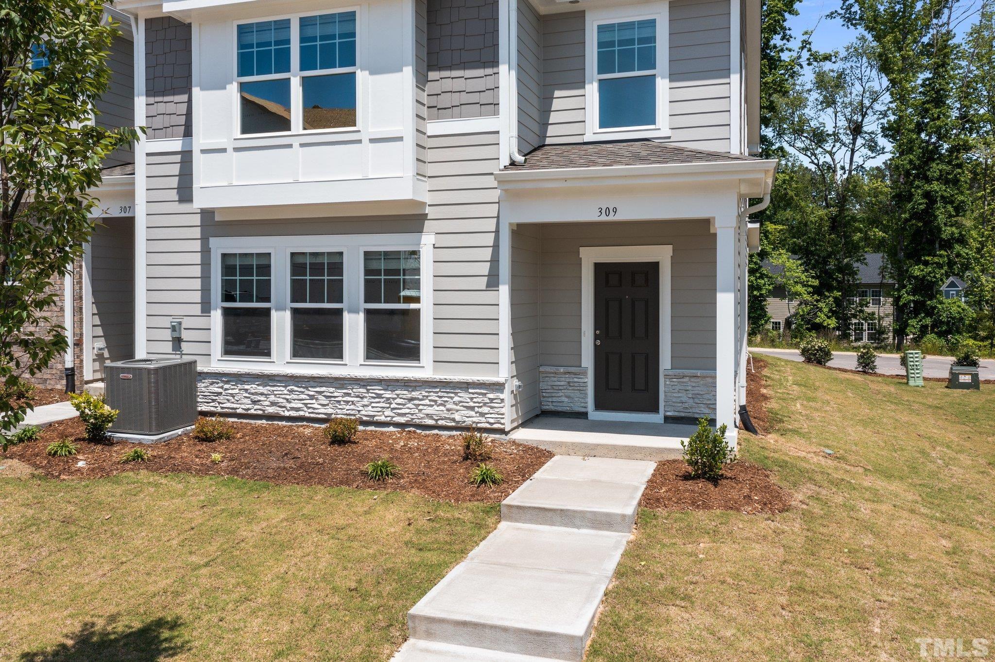 309 Spaight Acrs Way Wake Forest, NC 27587 - Photo 33 of 41 front view of a brick house