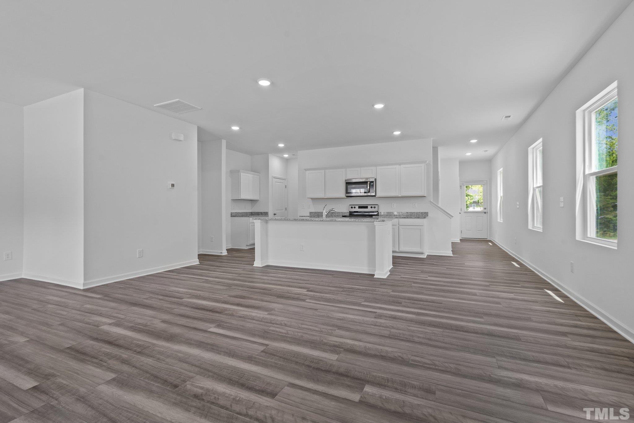 309 Spaight Acrs Way Wake Forest, NC 27587 - Photo 4 of 41 a view of kitchen with wooden floor