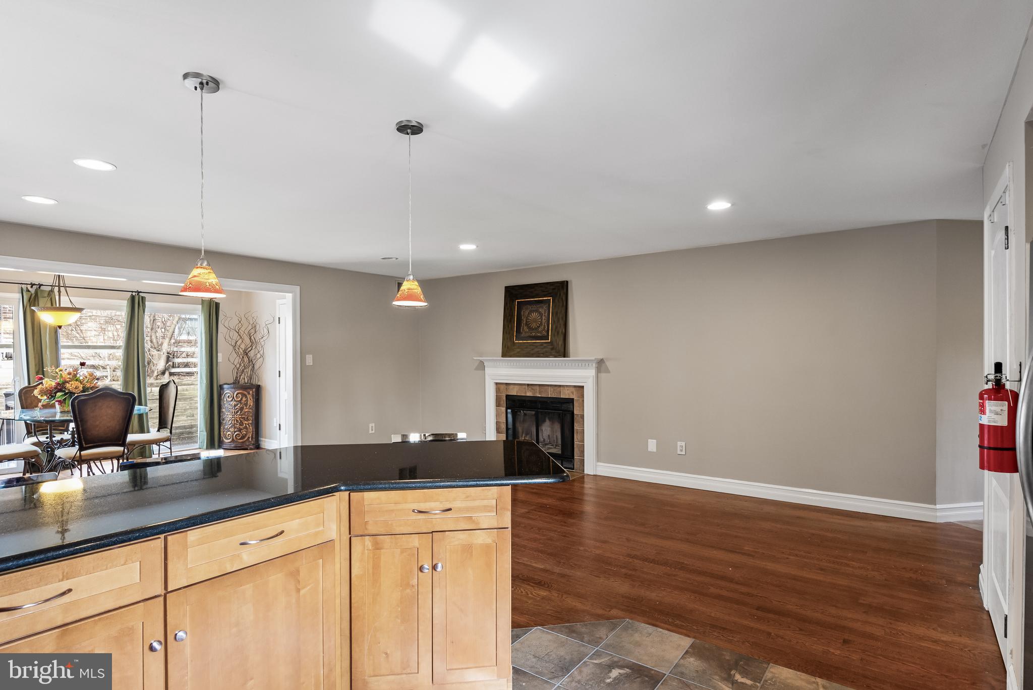 511 Chanticleer Cherry Hill, NJ 08003 - Photo 12 of 24 a large kitchen with stainless steel appliances a large counter top a stove a sink and a refrigerator with wooden floor