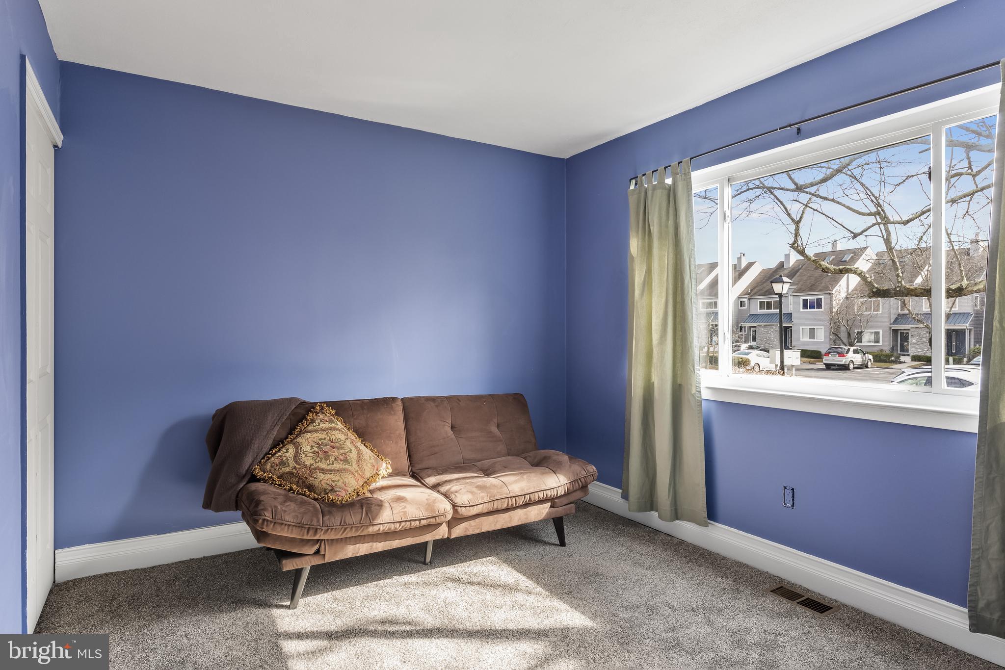 511 Chanticleer Cherry Hill, NJ 08003 - Photo 14 of 24 a living room with furniture and a large window