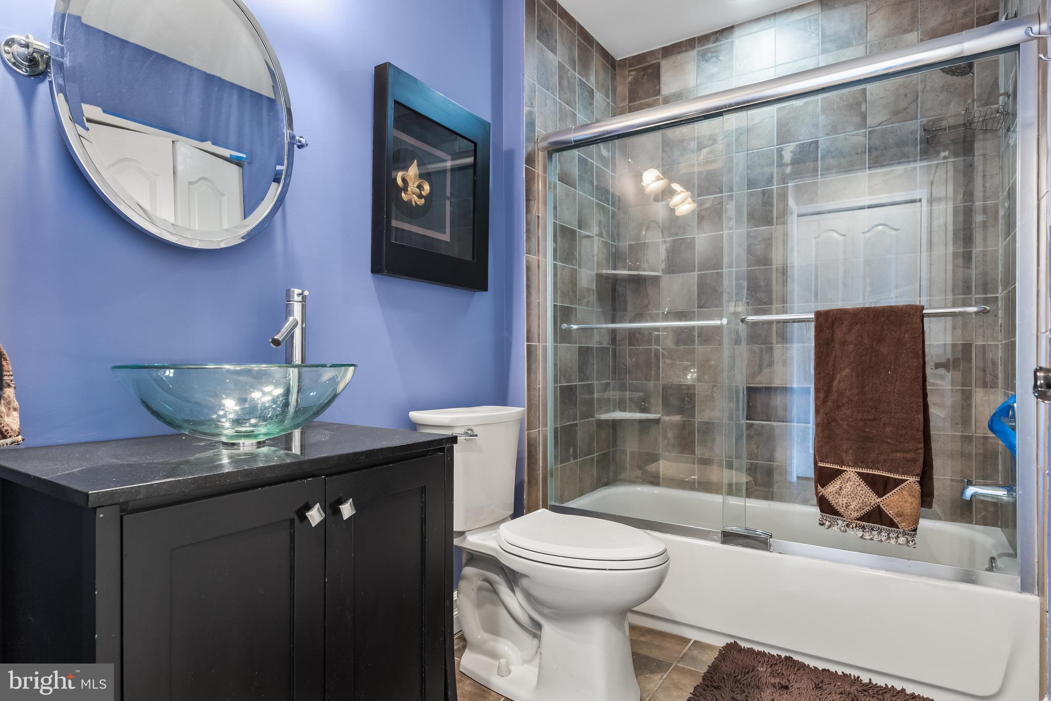 511 Chanticleer Cherry Hill, NJ 08003 - Photo 15 of 24 a bathroom with a granite countertop sink a toilet and mirror