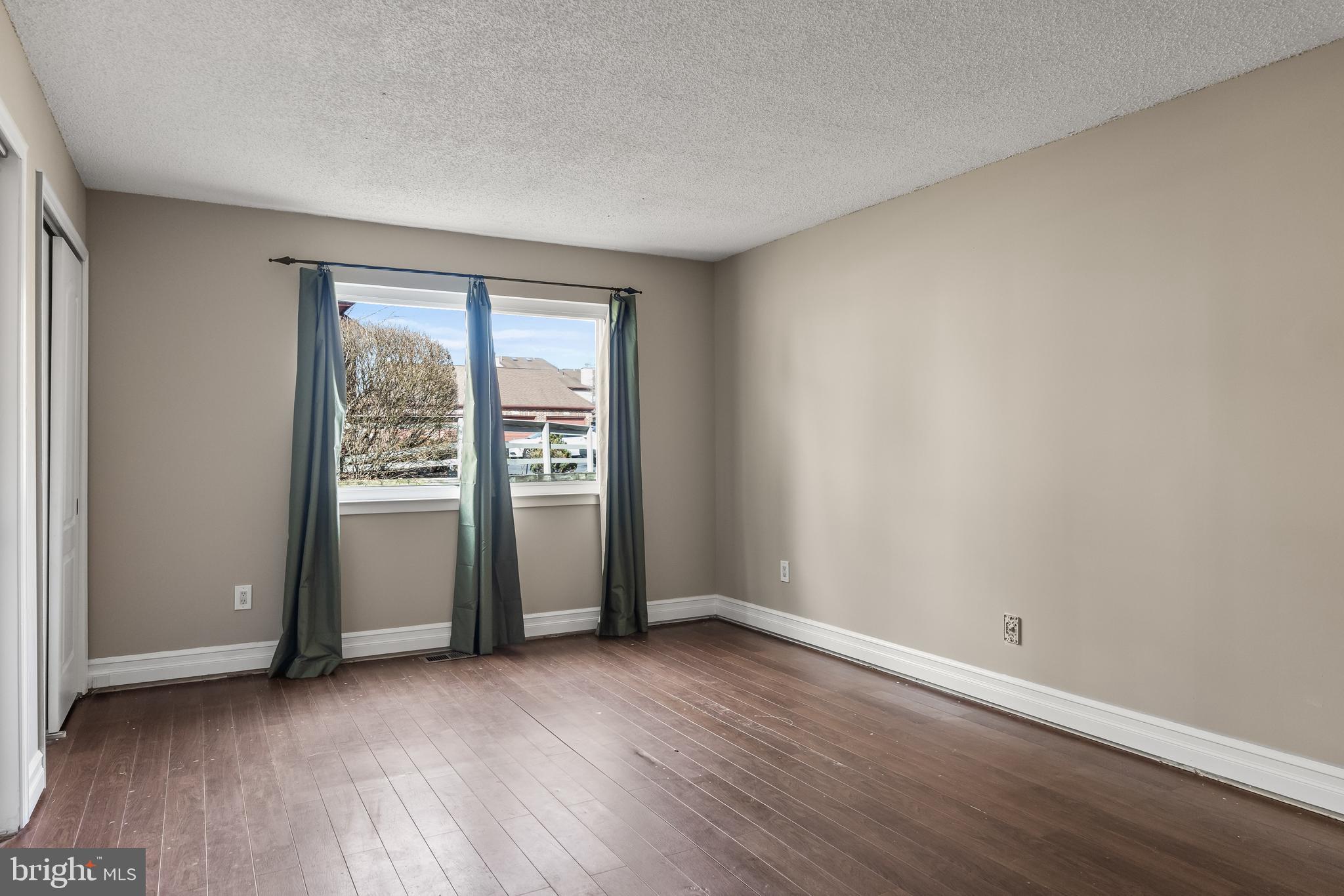 511 Chanticleer Cherry Hill, NJ 08003 - Photo 16 of 24 an empty room with wooden floor and windows