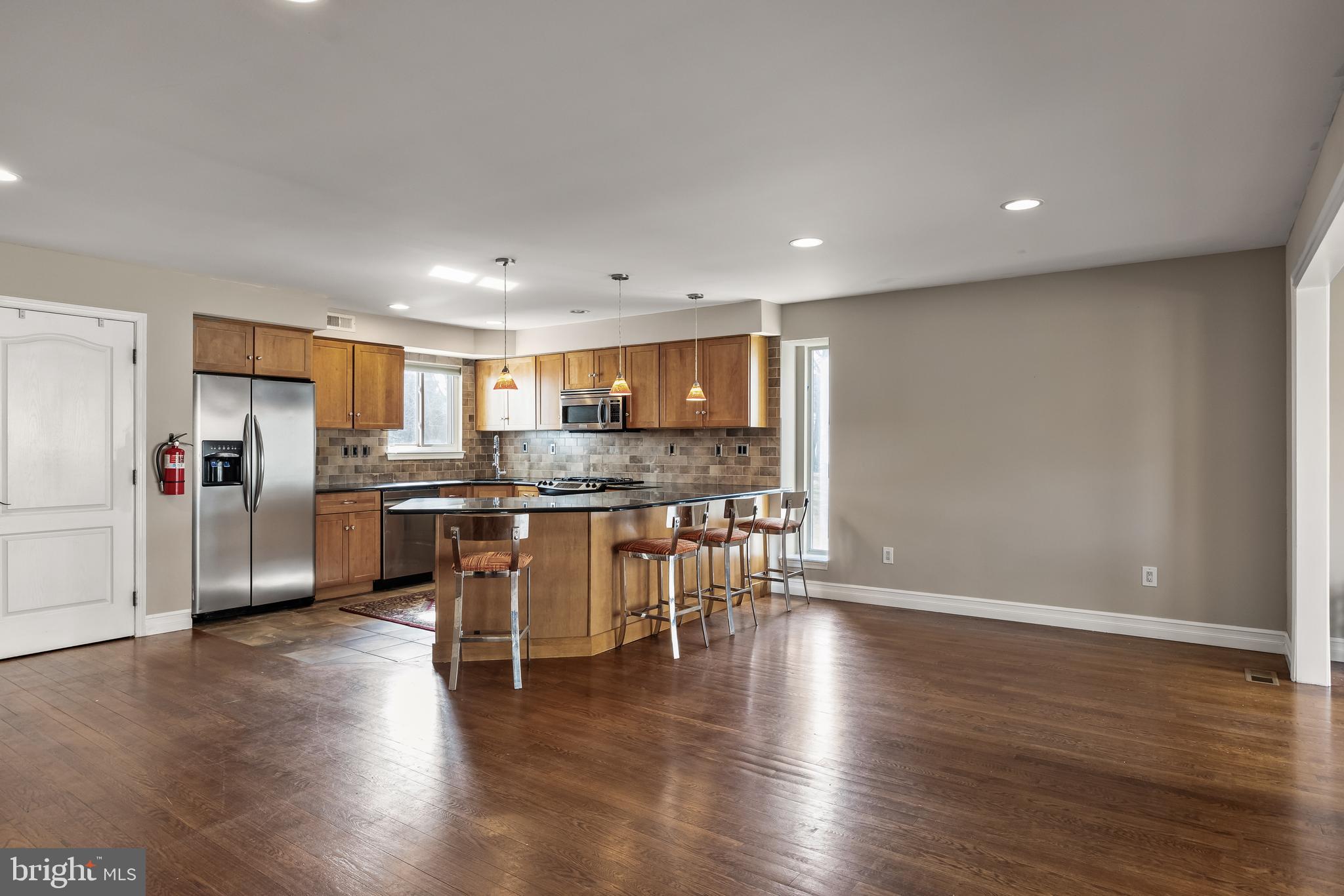 511 Chanticleer Cherry Hill, NJ 08003 - Photo 6 of 24 a kitchen with a refrigerator and white cabinets
