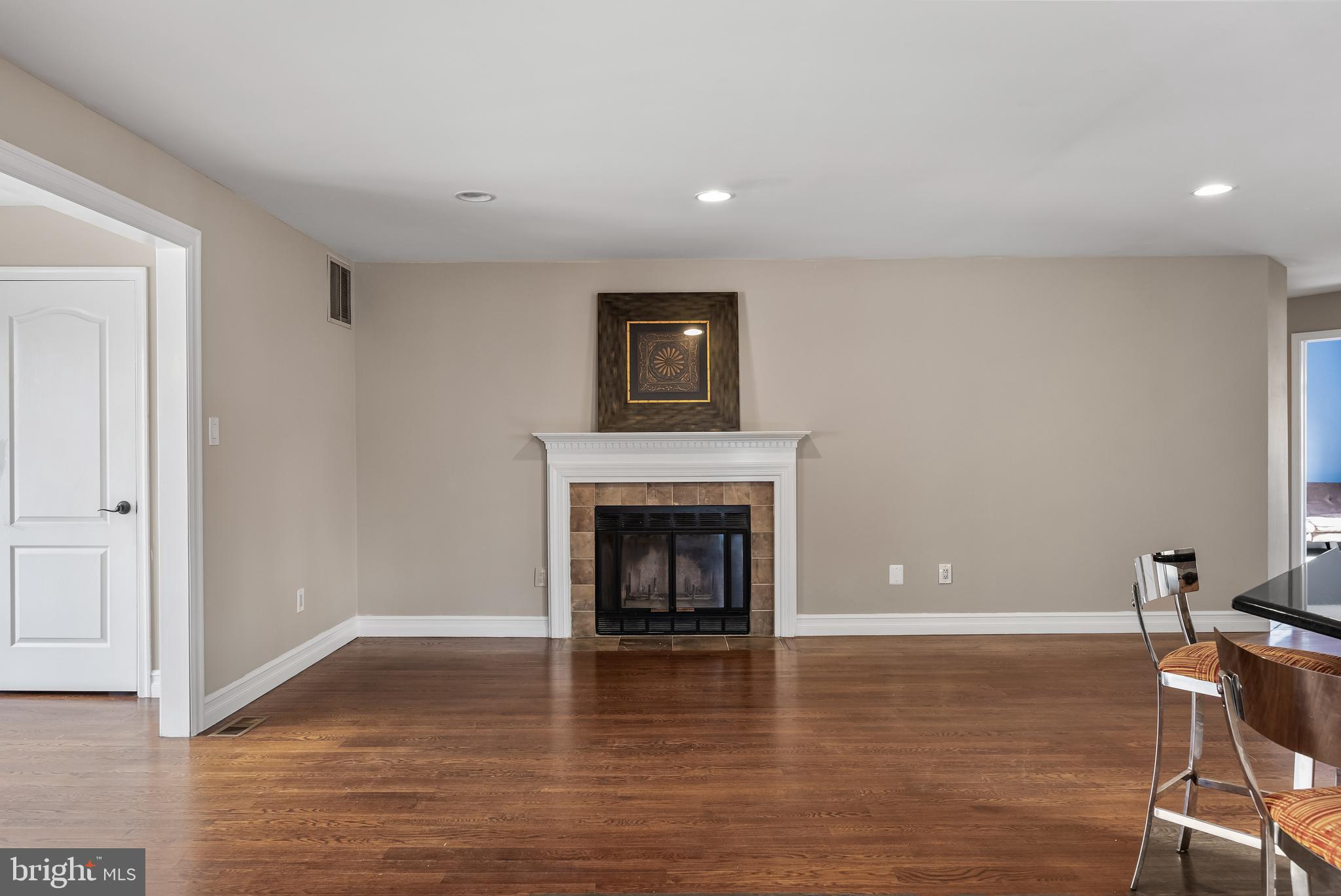 511 Chanticleer Cherry Hill, NJ 08003 - Photo 8 of 24 a view of livingroom with hardwood floor and fireplace