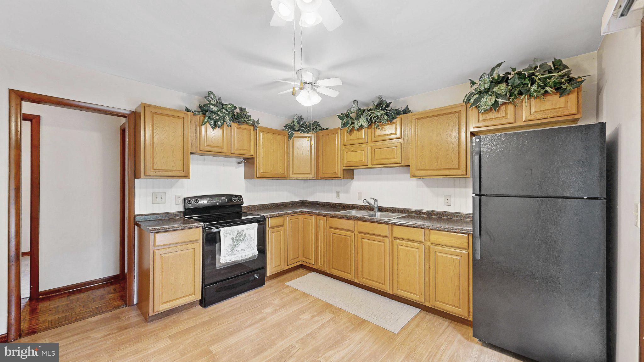 163 Pratts Branch Road Felton, DE 19943 - Photo 21 of 55 Bright kitchen with warm wood tones.