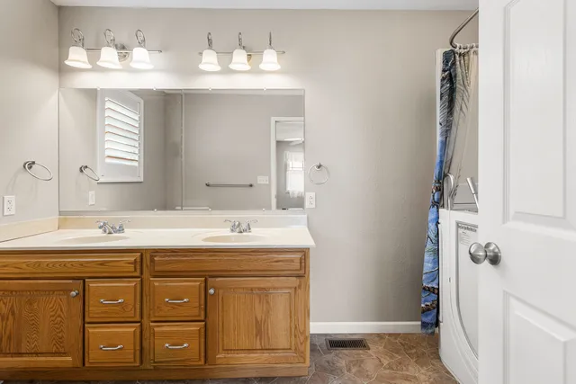 a bathroom with a sink and a mirror