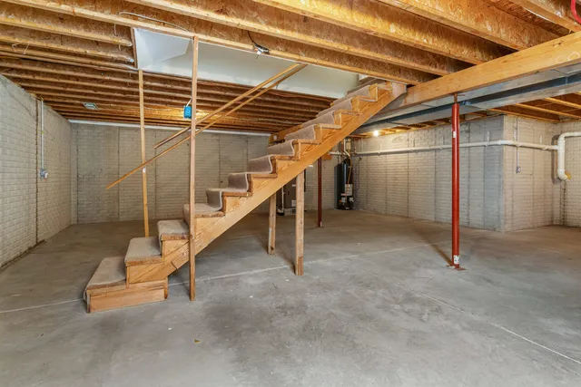a view of empty room with wooden walls