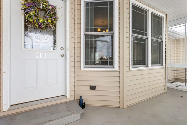 a view of white door and a window