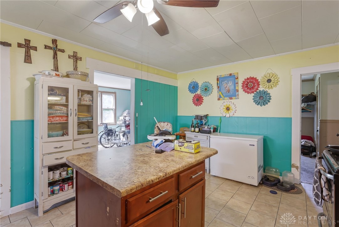 2390 Ridge Road Zanesville, OH 43701 - Photo 14 of 45 This bright kitchen features a functional island and easy-care tile flooring.
