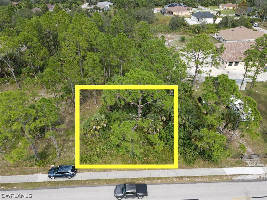 103 East 6th Street Lehigh Acres, FL 33972 - Photo 1 of 3 a view of a garden from a window