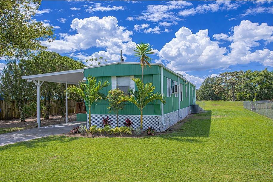 2009 Pine Street St. Cloud, FL 34769 - Photo 12 of 17 a backyard of a house with lots of green space