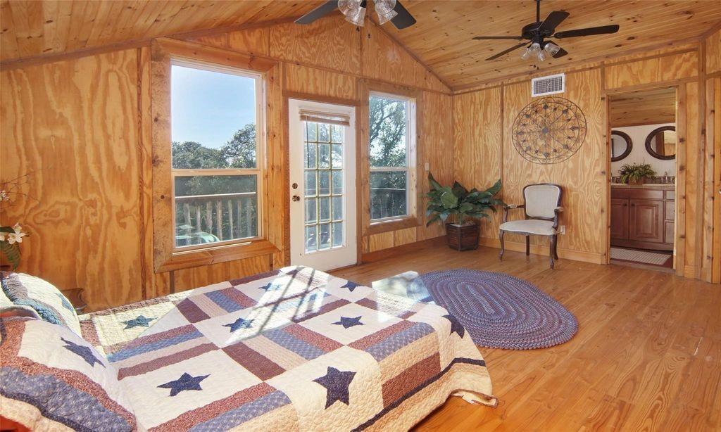 504 Doe Lane Graham, TX 76450 - Photo 13 of 27 a bed room with a bed and a table