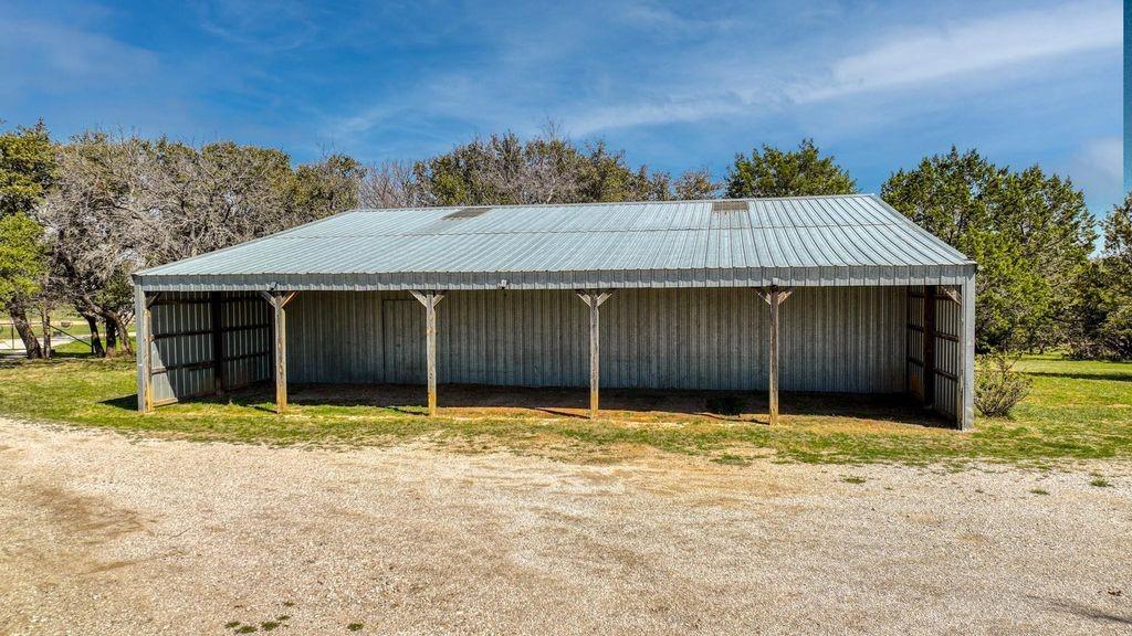 504 Doe Lane Graham, TX 76450 - Photo 4 of 27 a house with trees in the background