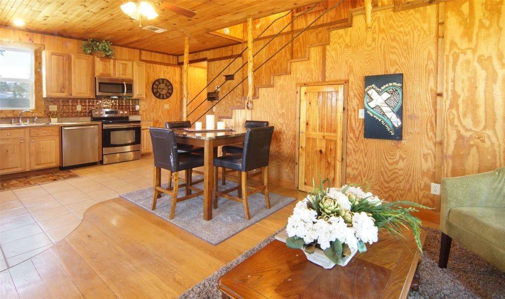 504 Doe Lane Graham, TX 76450 - Photo 8 of 27 a dining room with furniture and wooden floor