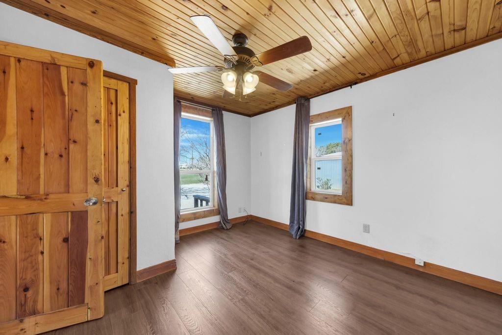 504 Doe Lane Graham, TX 76450 - Photo 10 of 27 a view of an empty room with wooden floor and a window
