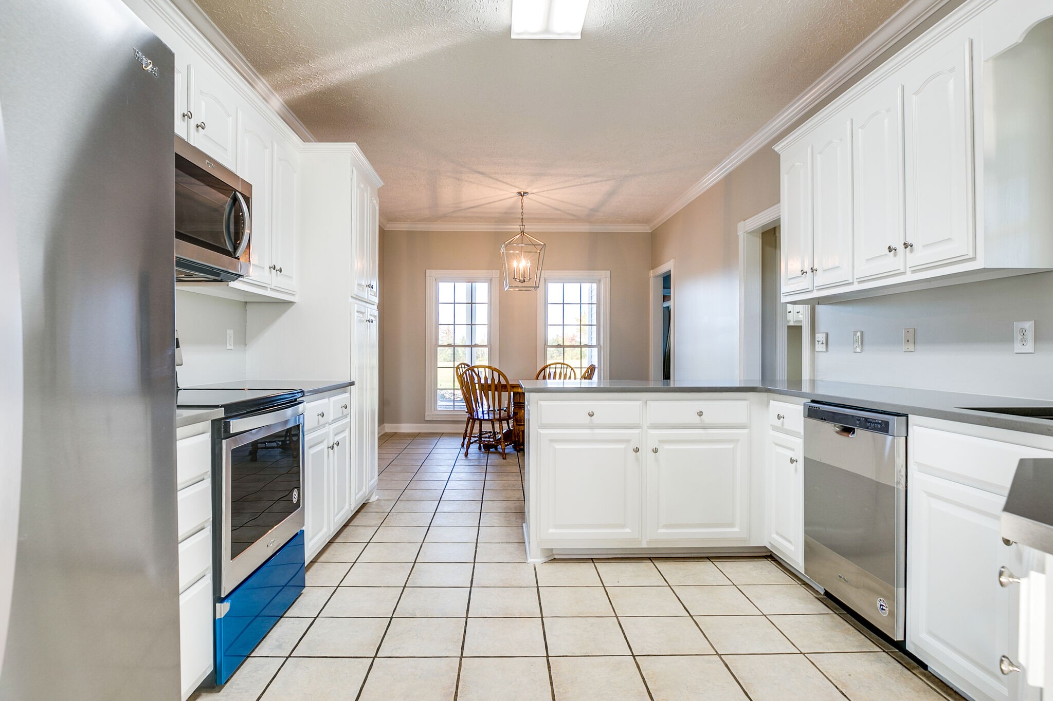 163 Harper Road Manchester, TN 37355 - Photo 15 of 43 a kitchen with stainless steel appliances a stove sink and cabinets
