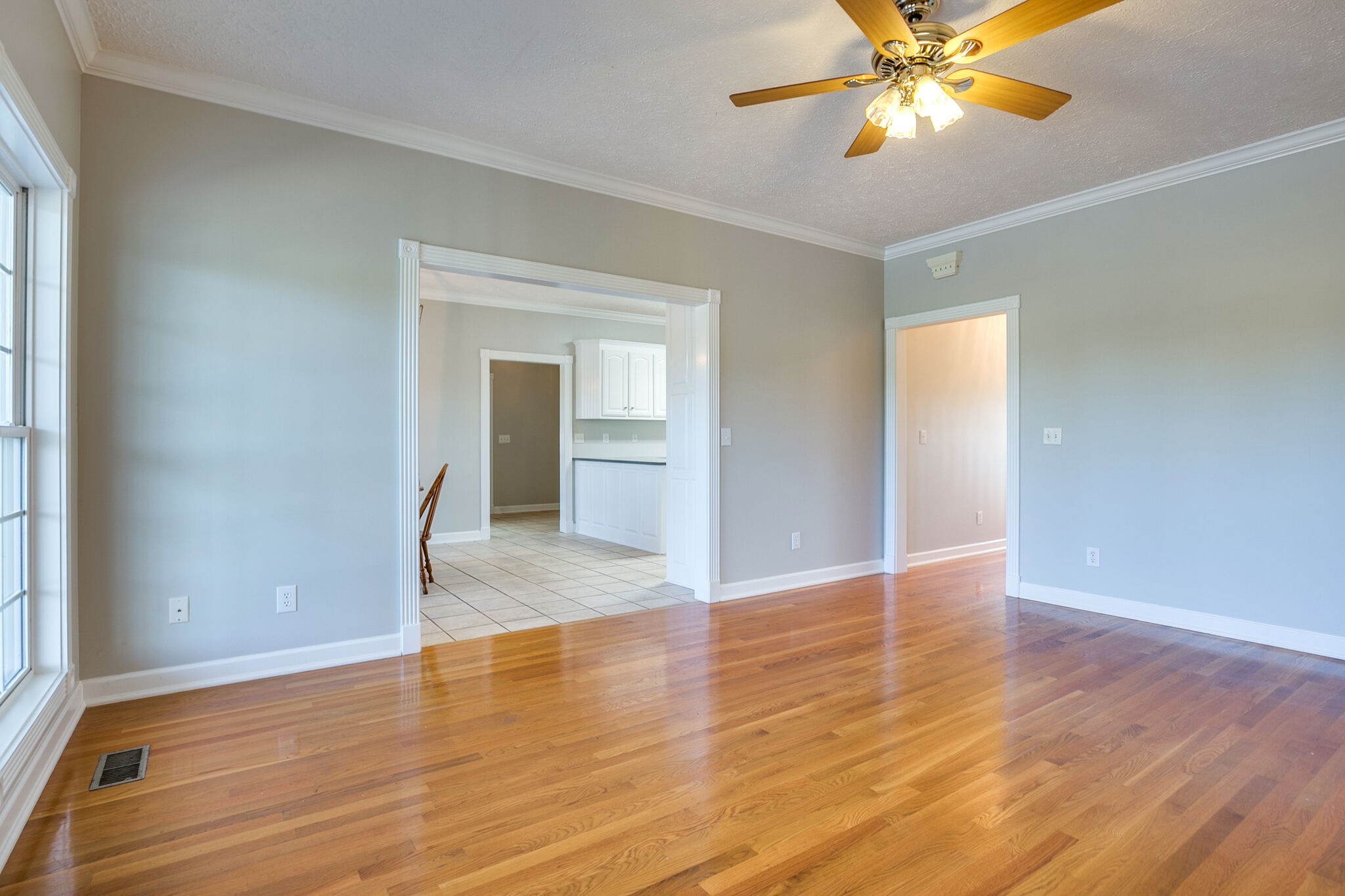 163 Harper Road Manchester, TN 37355 - Photo 19 of 43 a view of an empty room with wooden floor and a window