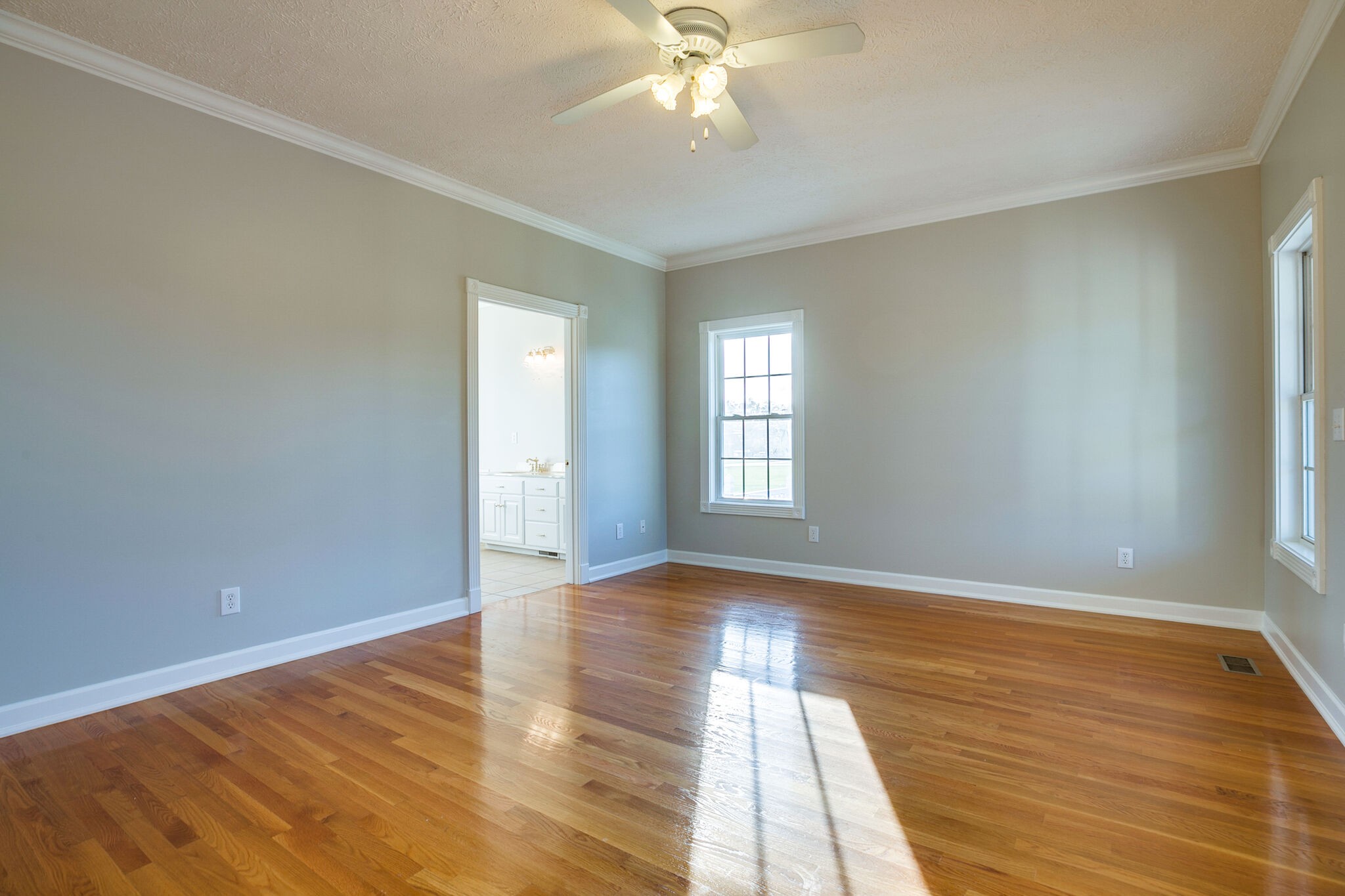 163 Harper Road Manchester, TN 37355 - Photo 22 of 43 a view of an empty room with wooden floor and a window