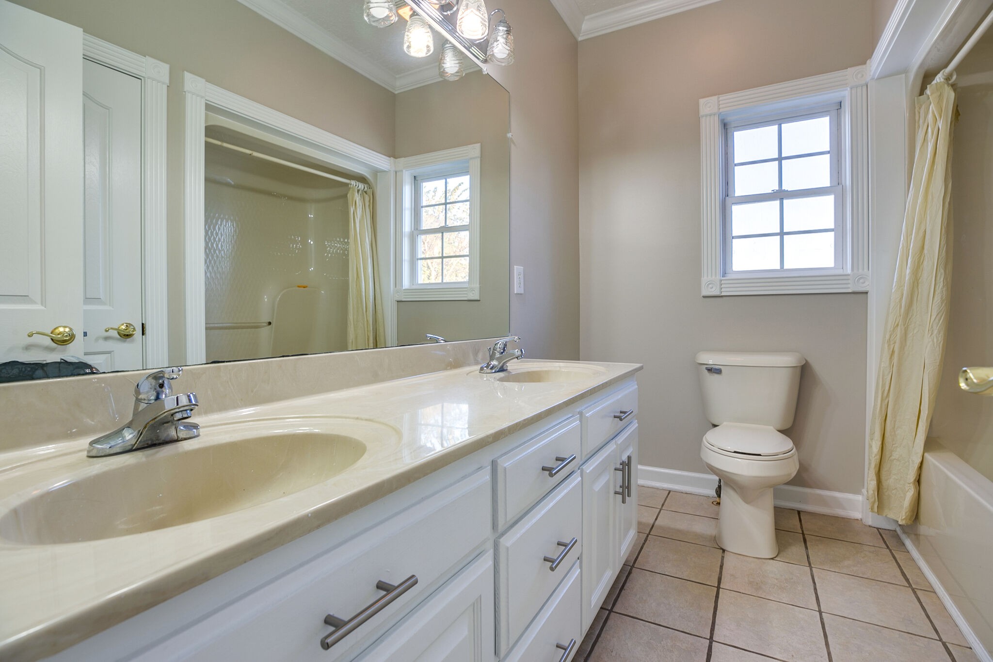 163 Harper Road Manchester, TN 37355 - Photo 25 of 43 a bathroom with a granite countertop sink a toilet and a mirror