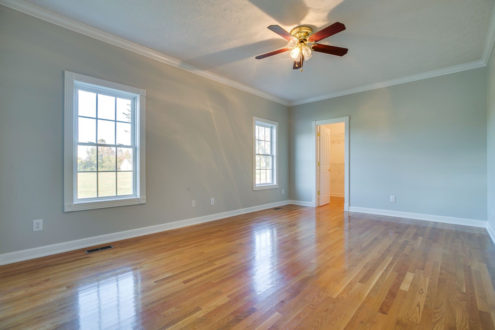 163 Harper Road Manchester, TN 37355 - Photo 26 of 43 a view of an empty room with window and wooden floor
