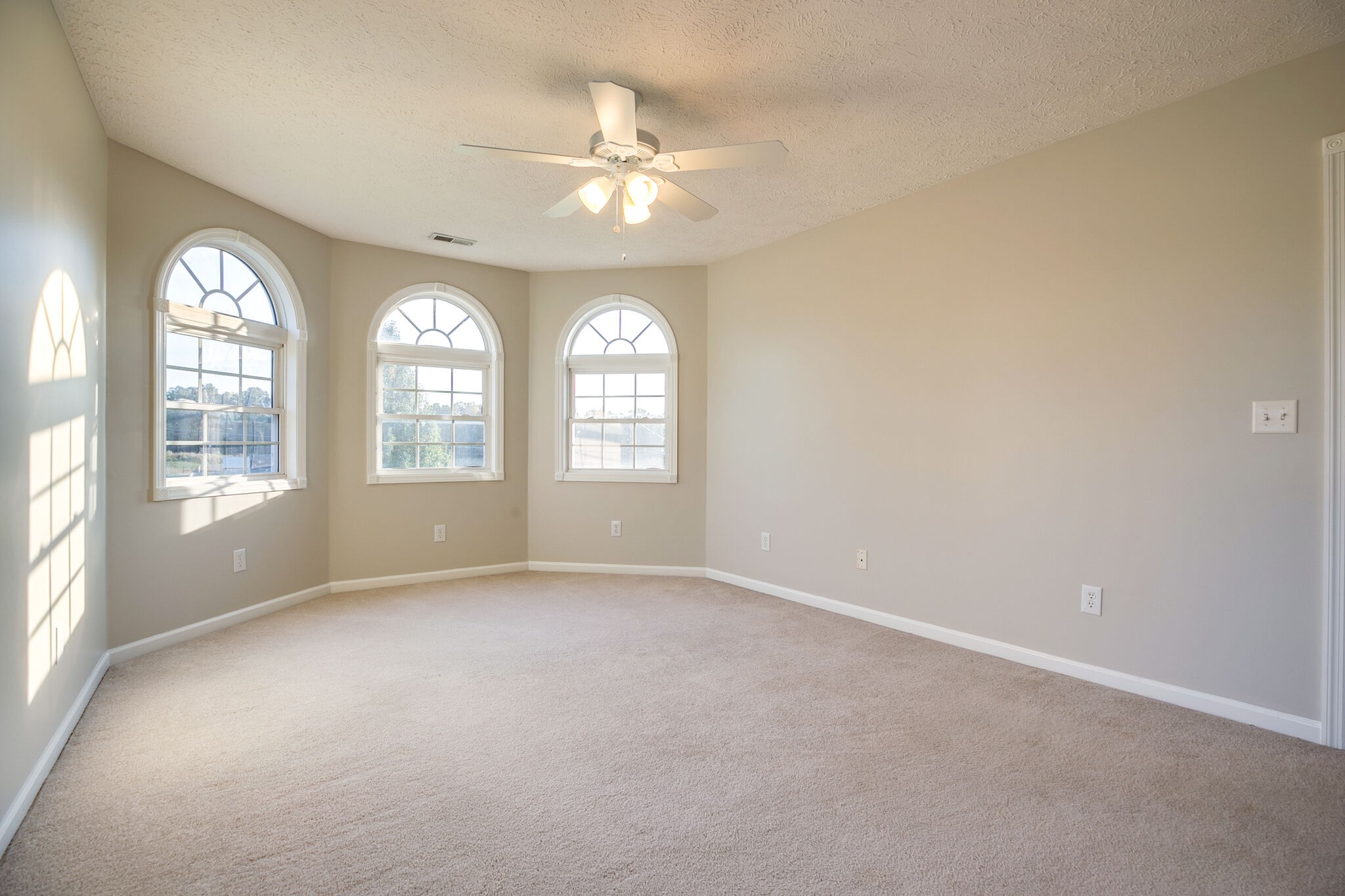 163 Harper Road Manchester, TN 37355 - Photo 34 of 43 an empty room with chandelier fan and windows