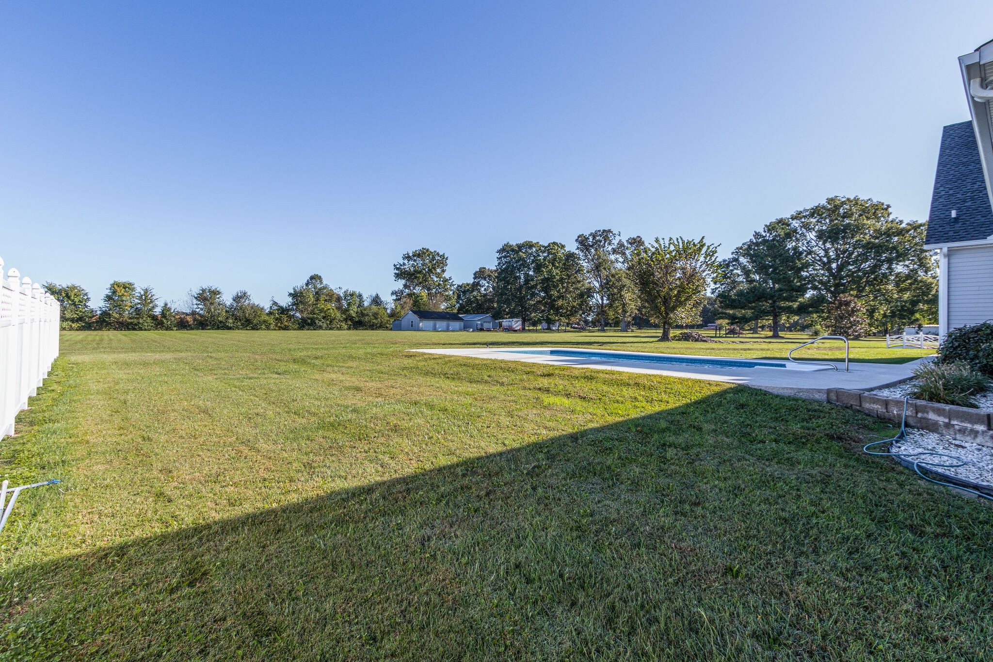 163 Harper Road Manchester, TN 37355 - Photo 41 of 43 a view of a swimming pool with an outdoor seating and a yard