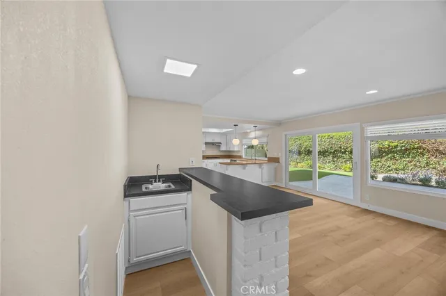 a kitchen that has a sink and a stove