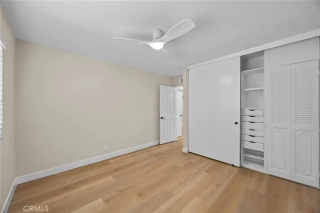 an empty room with closet area