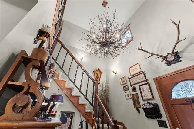 a kitchen with stainless steel appliances granite countertop a stove a sink dishwasher and a dining table with chairs