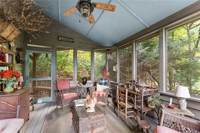 a view of a chairs and table in the balcony