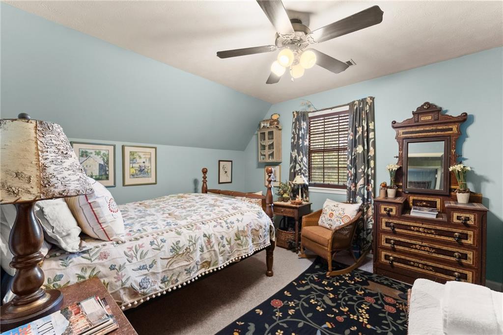 62 High Ridge Road Cleveland, GA 30528 - Photo 37 of 55 a bedroom with a bed and wooden floor