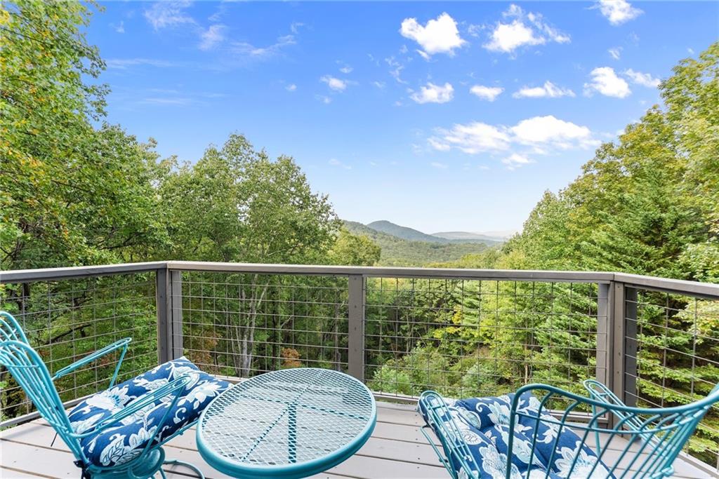 62 High Ridge Road Cleveland, GA 30528 - Photo 39 of 55 a view of a balcony with a swing
