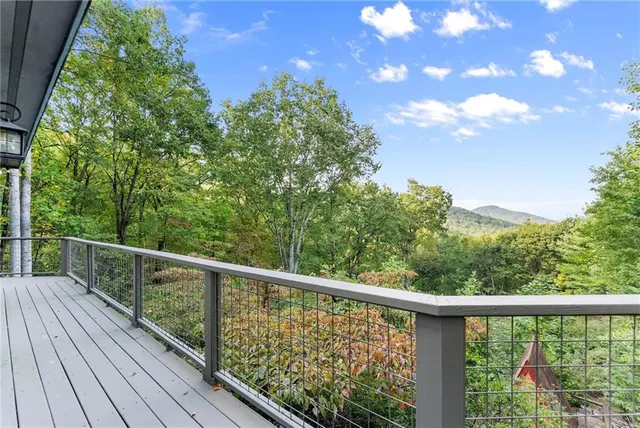 a view of two chairs in balcony