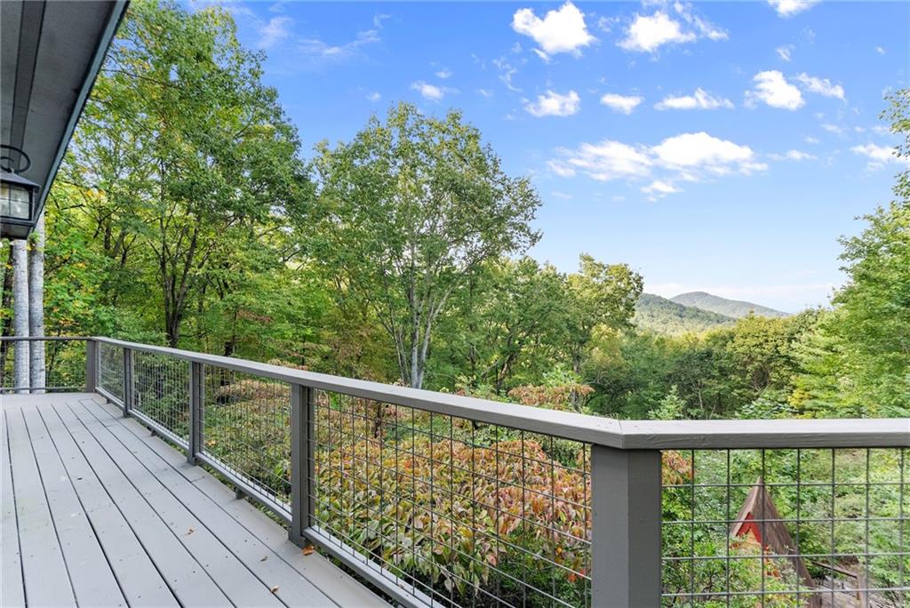 62 High Ridge Road Cleveland, GA 30528 - Photo 42 of 55 a view of a balcony with wooden floor and fence