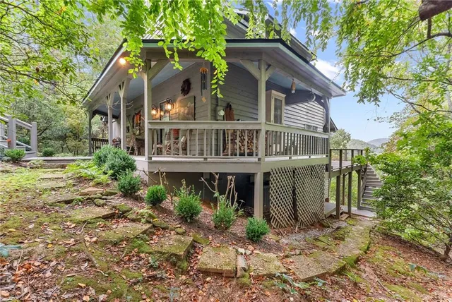 a view of balcony with wooden floor and outdoor seating