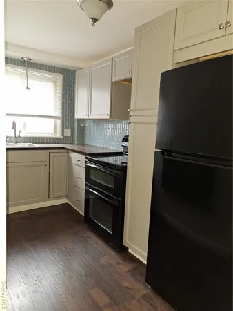 a kitchen with appliances and cabinets
