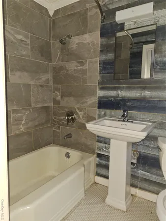 a bathroom with a sink and a bathtub